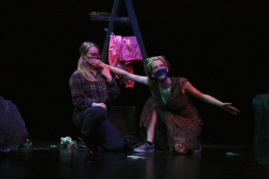 one character covers the other's mouth in an exaggerated way in Exit 7'